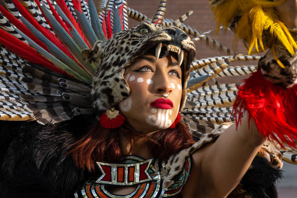 istock Aztec Warrior Princess looks into the sun. 1617457592