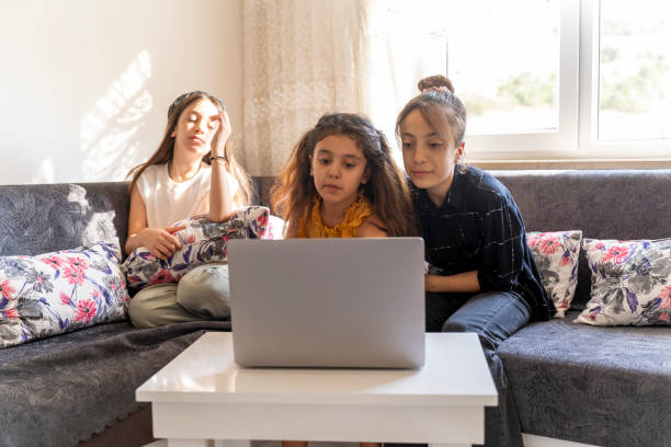istock Girls watching movies on the computer. 1617460061