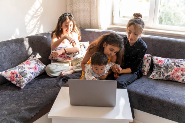 istock Girls watching movies on the computer. 1617461607