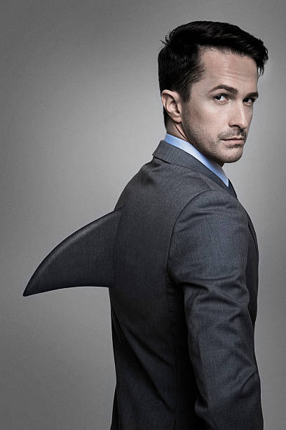 Businessman with a shark fin. Success concept.