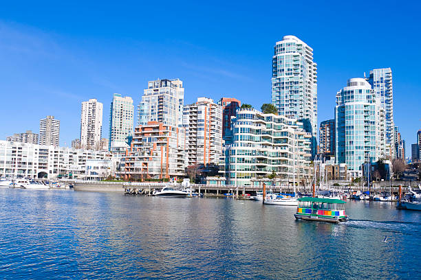 Apartments from Vancouver's Granville Island Apartments of the West End, and the North Shore in Vancouver, British Columbia, Canada. beach english bay vancouver skyline stock pictures, royalty-free photos & images
