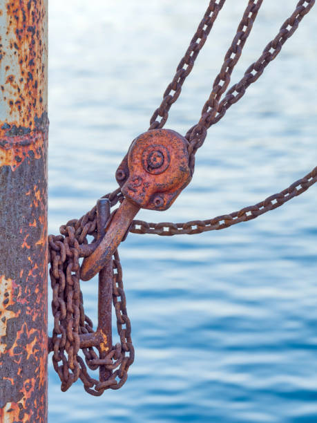 Island of Maui in Hawaii Chain and winch at the Lahaina harbor in Maui Hawaii rusted chain stock pictures, royalty-free photos & images