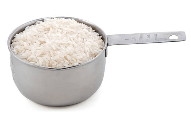 White Long Grain Rice In An American Metal Cup Measure Stock Photo -  Download Image Now - iStock