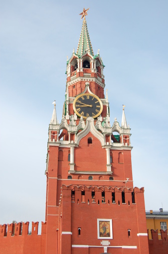 The Spasskaya Tower (Savior Tower) of the Moscow Kremlin.Сhiming clock.  It is the best known of kremlins (Russian citadels) and includes four palaces, four cathedrals and the enclosing Kremlin Wall with Kremlin towers.