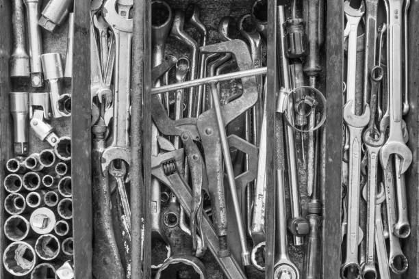 istock Flat lay of many used tools in rustic compartments toolbox. 1617565911