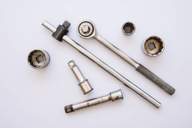 Used set of tool ratchet torque wrench, socket wrench on white background.