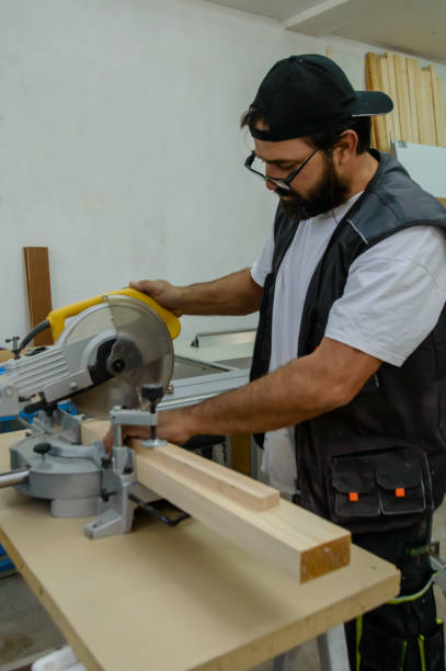 istock An Experienced Carpenter is Working in Carpentry Workshop Using an Electric Circular Saw. 1617573760