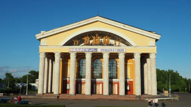 The Musical Theater of the Republic of Karelia, a state theater in Petrozavodsk. People and children are walking. August 3, 2022 Kirov Square. Facade with columns. Cars drive along Pushkinskaya street stock photo