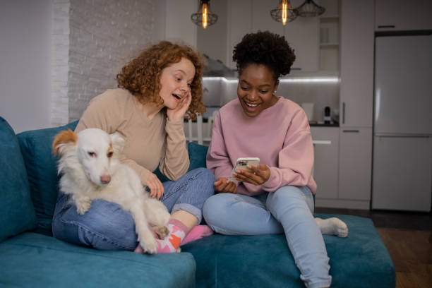 istock Happy two friends are spending time together at home. 1617588785