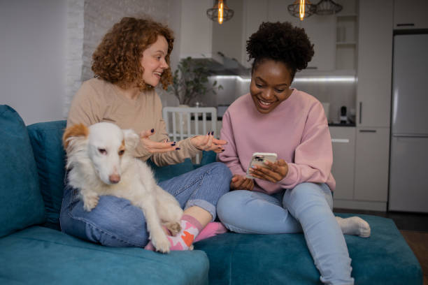 istock Two happy young women are chatting 1617588846