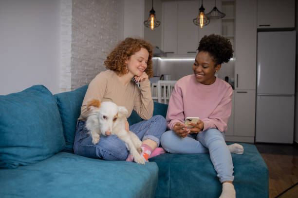 istock Two happy young women are chatting 1617588854