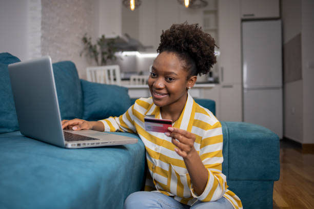 istock Cheerful  young woman doing online shopping 1617589919