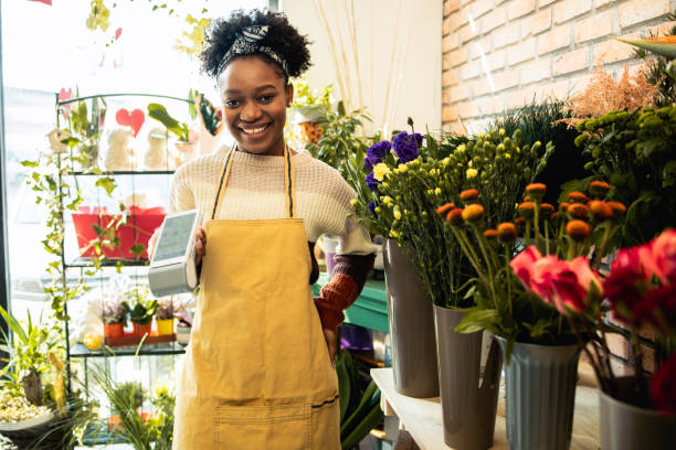istock Young business owner designs a custom bridal bouquet 1617591028