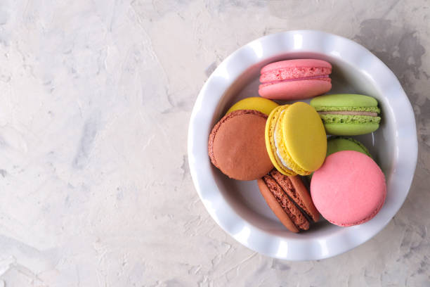 istock Macaroons on a light background. Sweet French cake, different types of macarons. 1617597186