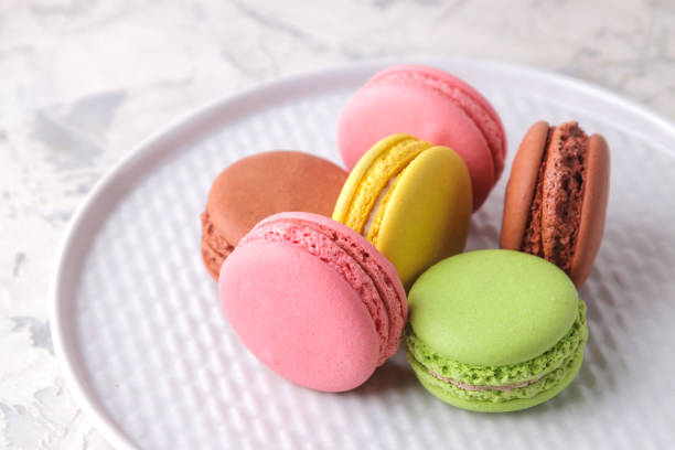 istock Macaroons on a light background. Sweet French cake, different types of macarons. 1617597203