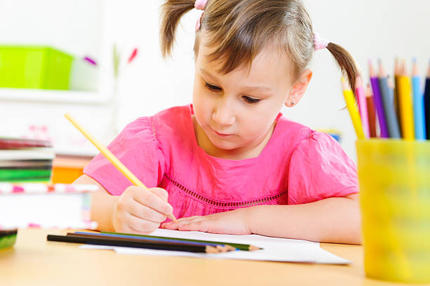 istock Cute little girl study at home 161760103