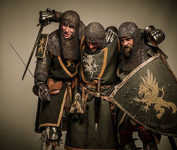 istock Two medieval knights carrying their buddy 161766945