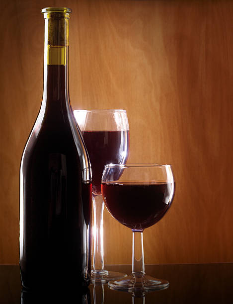 istock Red wine glass and bottle 161767176