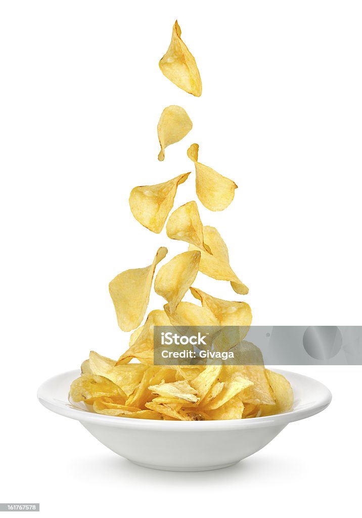 Kartoffel-chips fallen in der Teller - Lizenzfrei Kartoffelchips Stock-Foto
