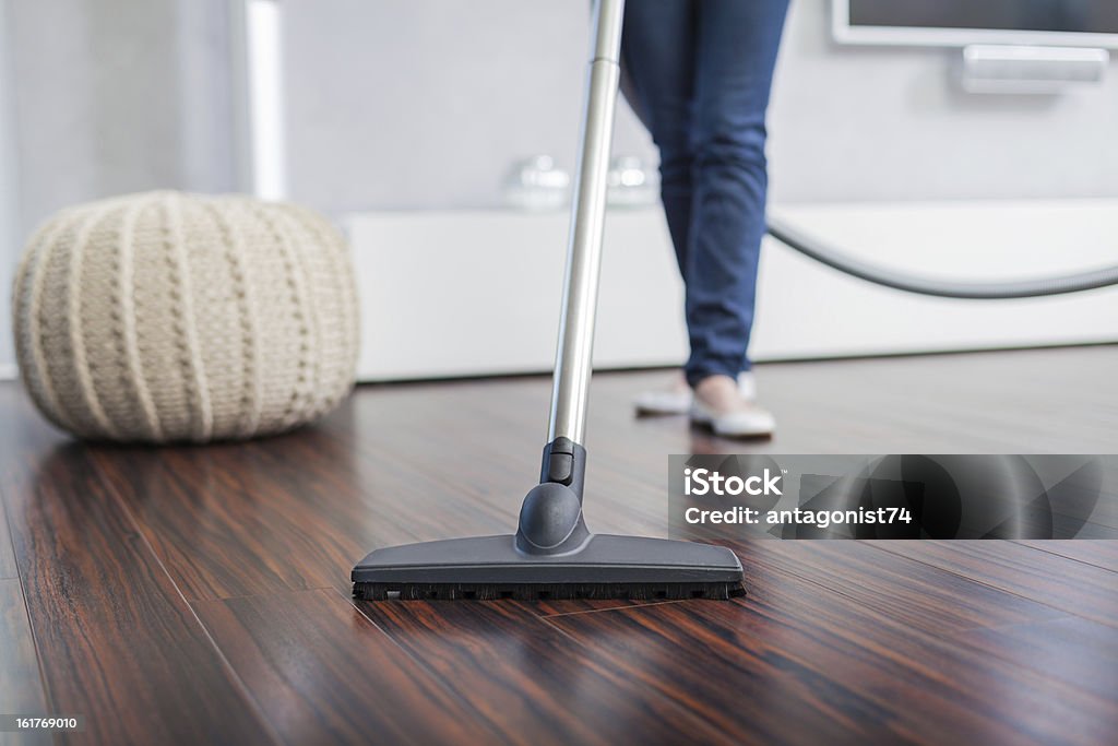 Attractive Female with Vacuum Cleaner Closeup of a Vacuum Cleaner in Living Room Vacuum Cleaner Stock Photo