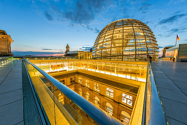 Berlin, Reichstag Dome Illuminated Reichstag Dome at Twilight. Ultra-Wide Angle Architecture Shot. bundestag stock pictures, royalty-free photos & images