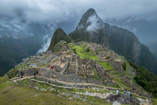 istock Macchu Picchu ruins surrounded by clouds and a stormy sky 1617751133