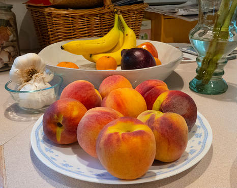 Ripe peaches on a plate