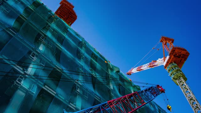 A timelapse of crane at the under construction in Tokyo zoom in