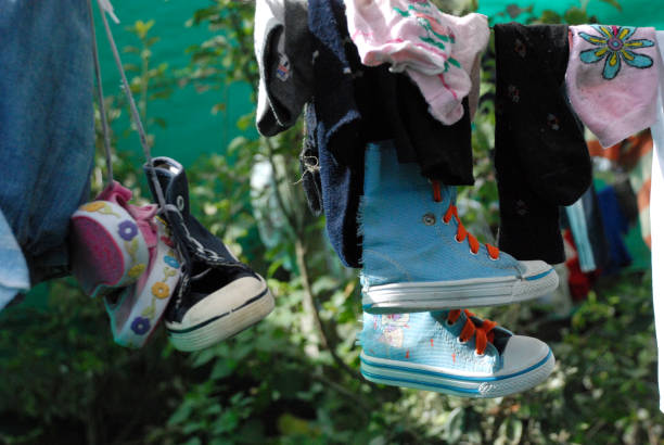 istock shoes clothes hanging 1617814778