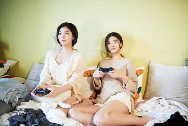 istock Asian best friends resting and relaxing on the sofa 1617831851