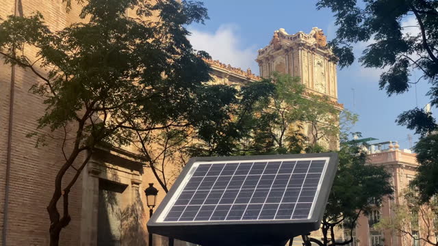 Solar panel in front of old buildings
