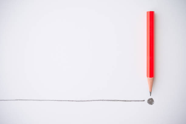Flat lay of red color pencil write line and end point on white paper background copy space. Business conclusion, creative idea, imagination and education concept.