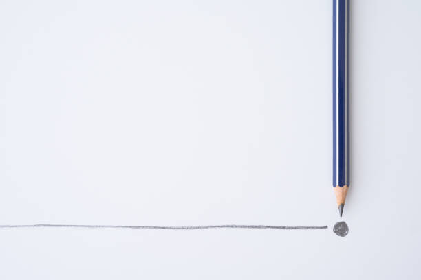 istock Flat lay of blue color pencil write line and end point on white paper background. 1617873135