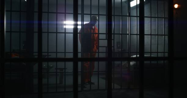 istock Two guilty inmates talks in detention center 1617893464