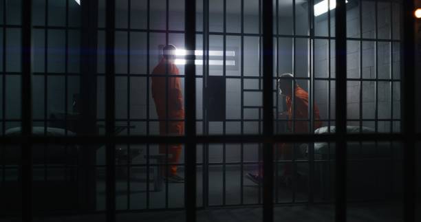 istock Two guilty inmates talks in detention center 1617893560