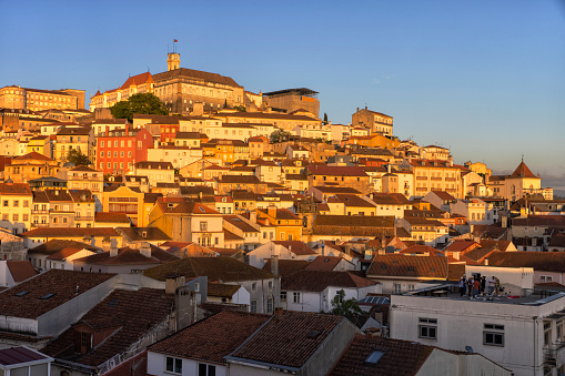 An aerial view of city skyline in Coimbra at sunset.