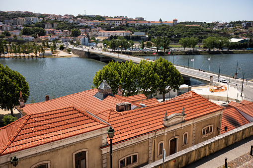 View of Coimbra by the Mondego River over Santa Clara bridge,  Portugal