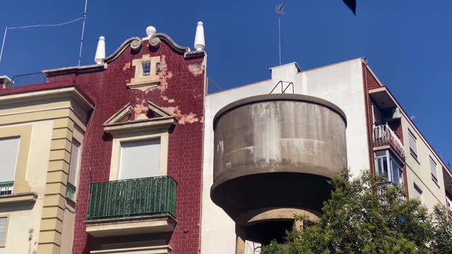 Storage water tank next to residential building
