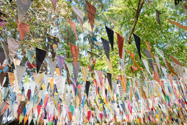 istock Colorful cloth bunting triangle shape decoration in outdoors summer festival. 1617907954