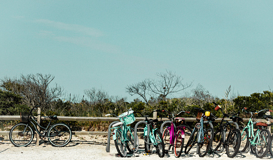 While visiting Wildwood, New Jersey there were bikes lined up against a gate near the ocean