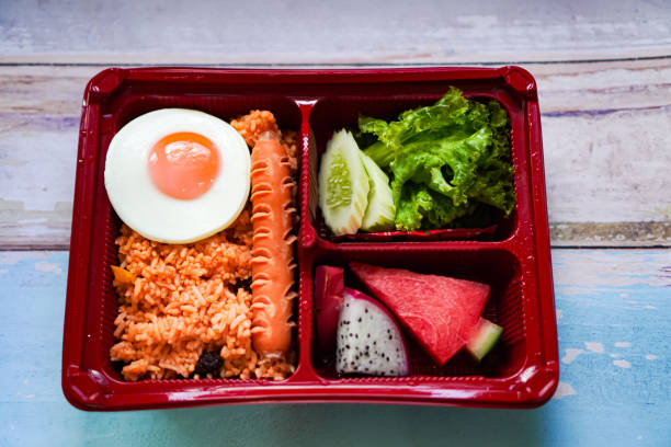 istock The photo above shows a homemade bento set menu that includes American fried rice, fried eggs and fresh fruit. 1617911554