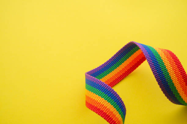 istock Rainbow headband LGBT like a LGBT pride flag on yellow background. 1617917863