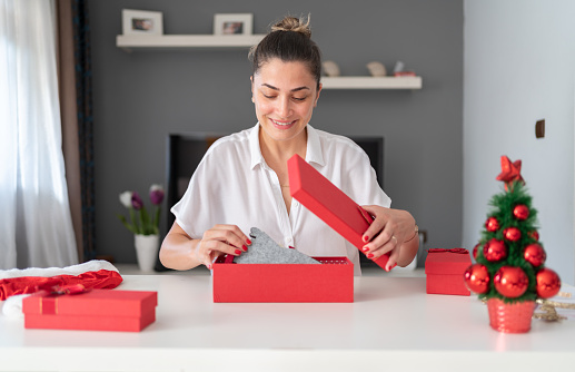 Happy Woman Wrapping Christmas Gifts