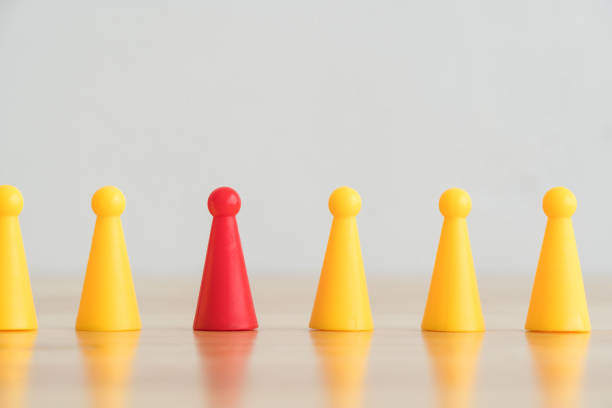 istock Leadership different from the crowd on wood table with white wall background and copy space. 1617933646