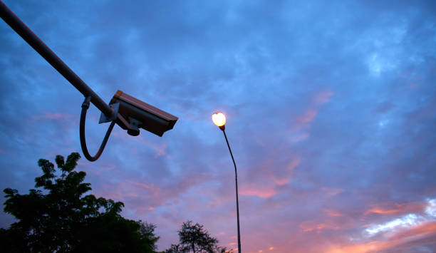CCTV camera with the sky stock photo