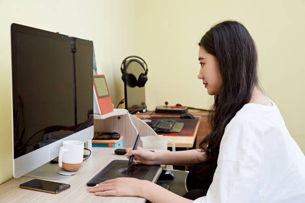 istock An Asian woman working from home on a computer 1617941894