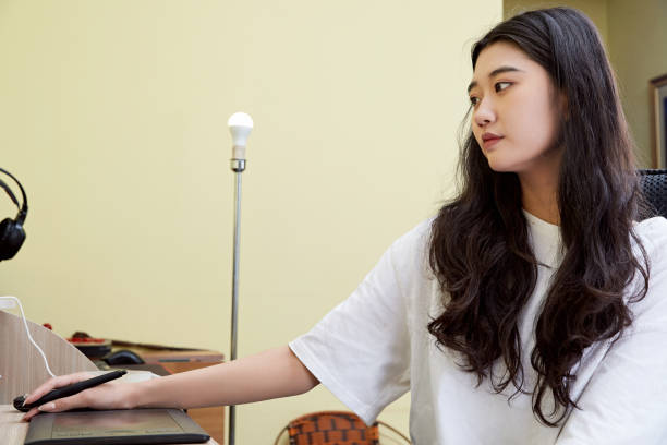istock An Asian woman working from home on a computer 1617942221