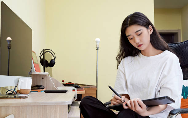 istock An Asian woman working from home on a computer 1617942513