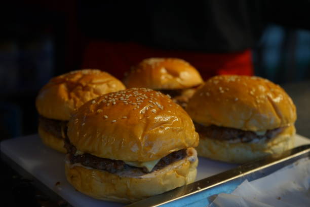 istock Four Beef Burger with Cheese and Sesame Bun 1617942558