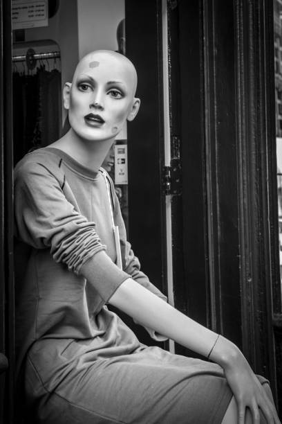 A mannequin wearing a dress in grayscale